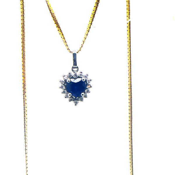Dije corazón zafiro con diamantes.
